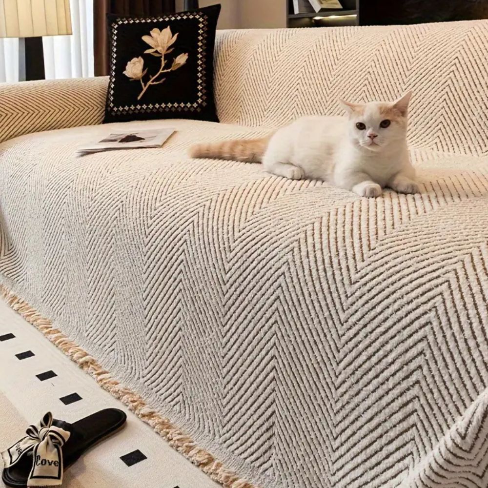 CozyGuard - Protective Herringbone Sofa Cover with Fringe Detail