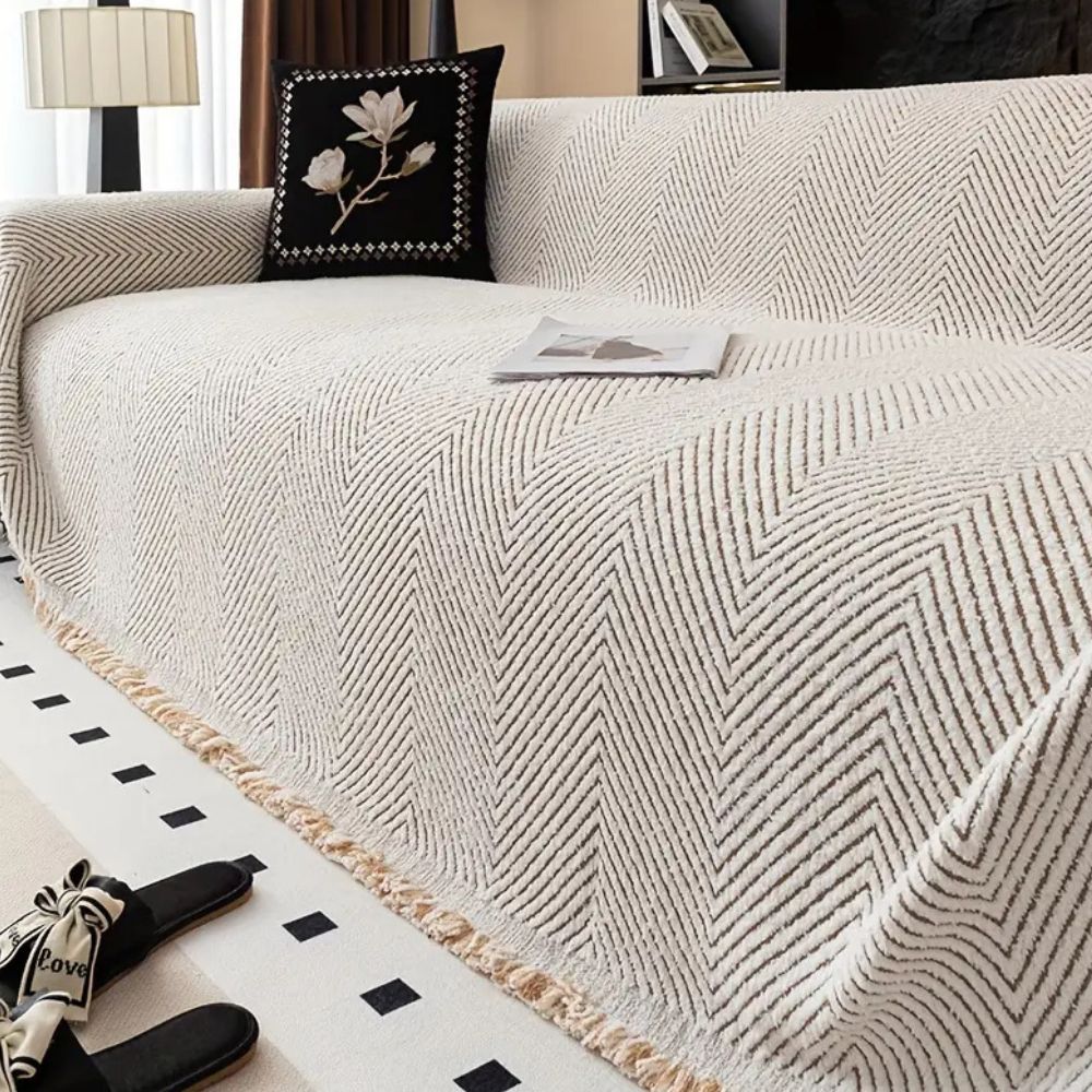 CozyGuard - Protective Herringbone Sofa Cover with Fringe Detail