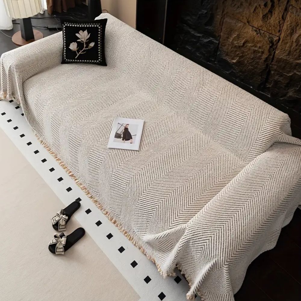 CozyGuard - Protective Herringbone Sofa Cover with Fringe Detail